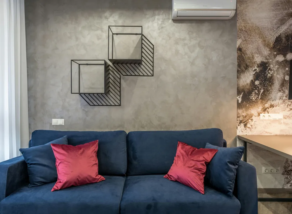 A comfortable living room with wall-mounted cooling